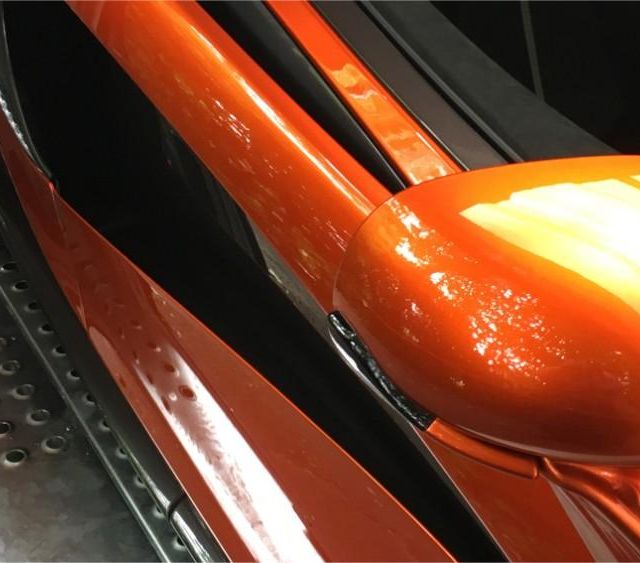 orange sports car wing mirror